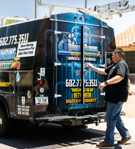 About Us 31 Robert Bridge closing Bridge Plumbing & HVAC service van after job completion.