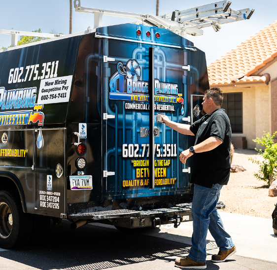 Meet the Team 34 Robert Bridge closing Bridge Plumbing & HVAC service van after job completion.