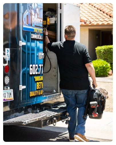Career 40 Robert Bridge loading tools into company service van during a house call.